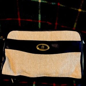 selling all four Etienne Aigner for 30 each.The burgundy bag wallet is worn